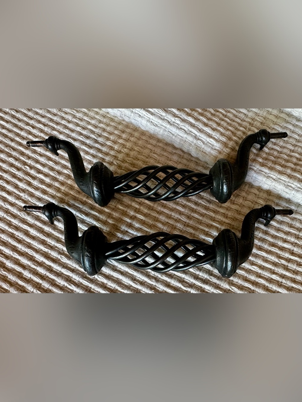 Pair (2) swirly antique look drawer pulls. Dark brown, some distressing.
